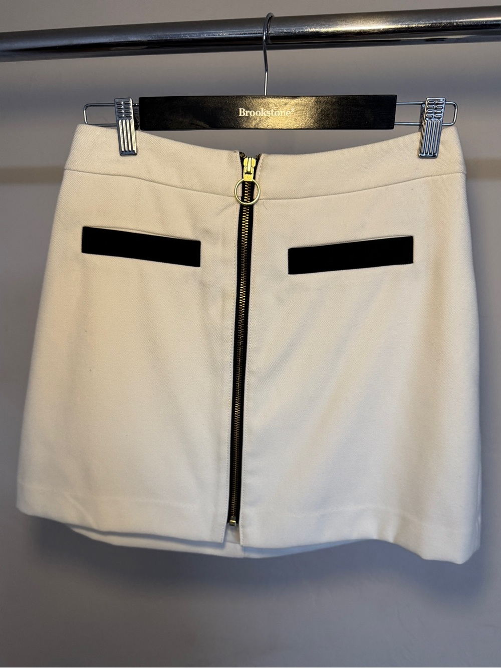 Express White Mini Skirt with Front Zip and Black Pocket Detail